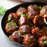 BBQ lentil meatballs. Simple plant-based ingredients of lentils, rice, mushrooms, and BBQ sauce